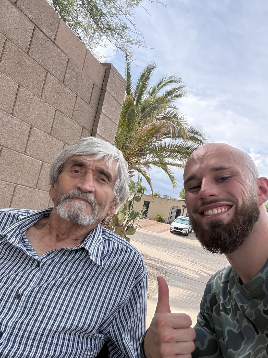 Blake Lannan with a Tucson homeowner after clearing yard debris from his walkway